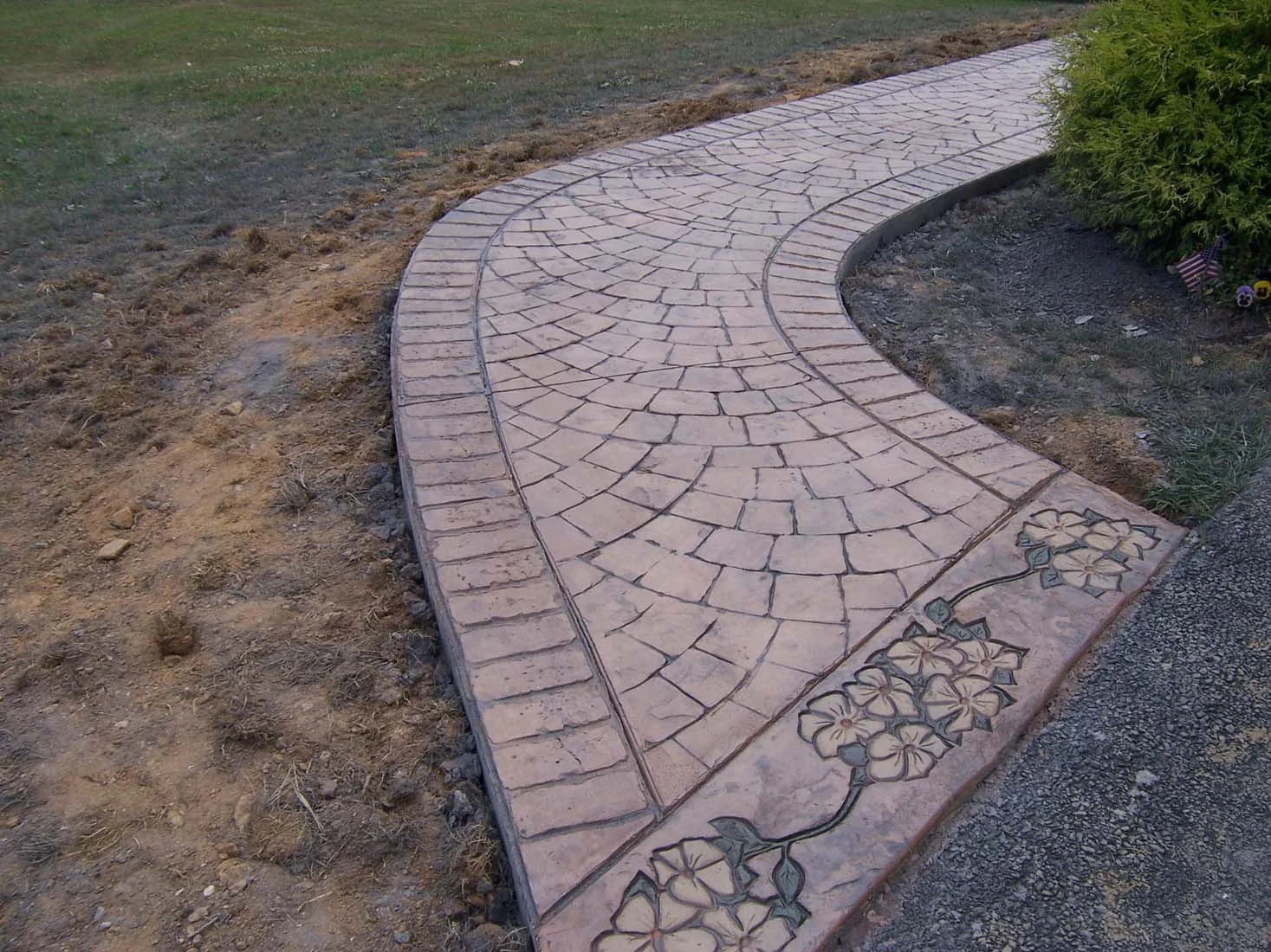 Decorative concrete walkway completed by Interscope Contractors